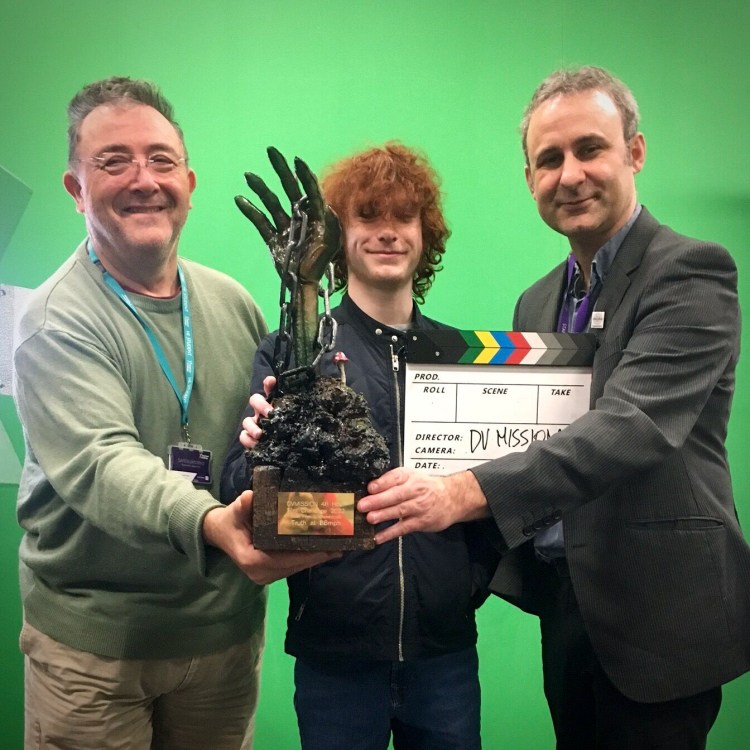 Lifting the trophy at DV Mission (Rob Hind on the Right)